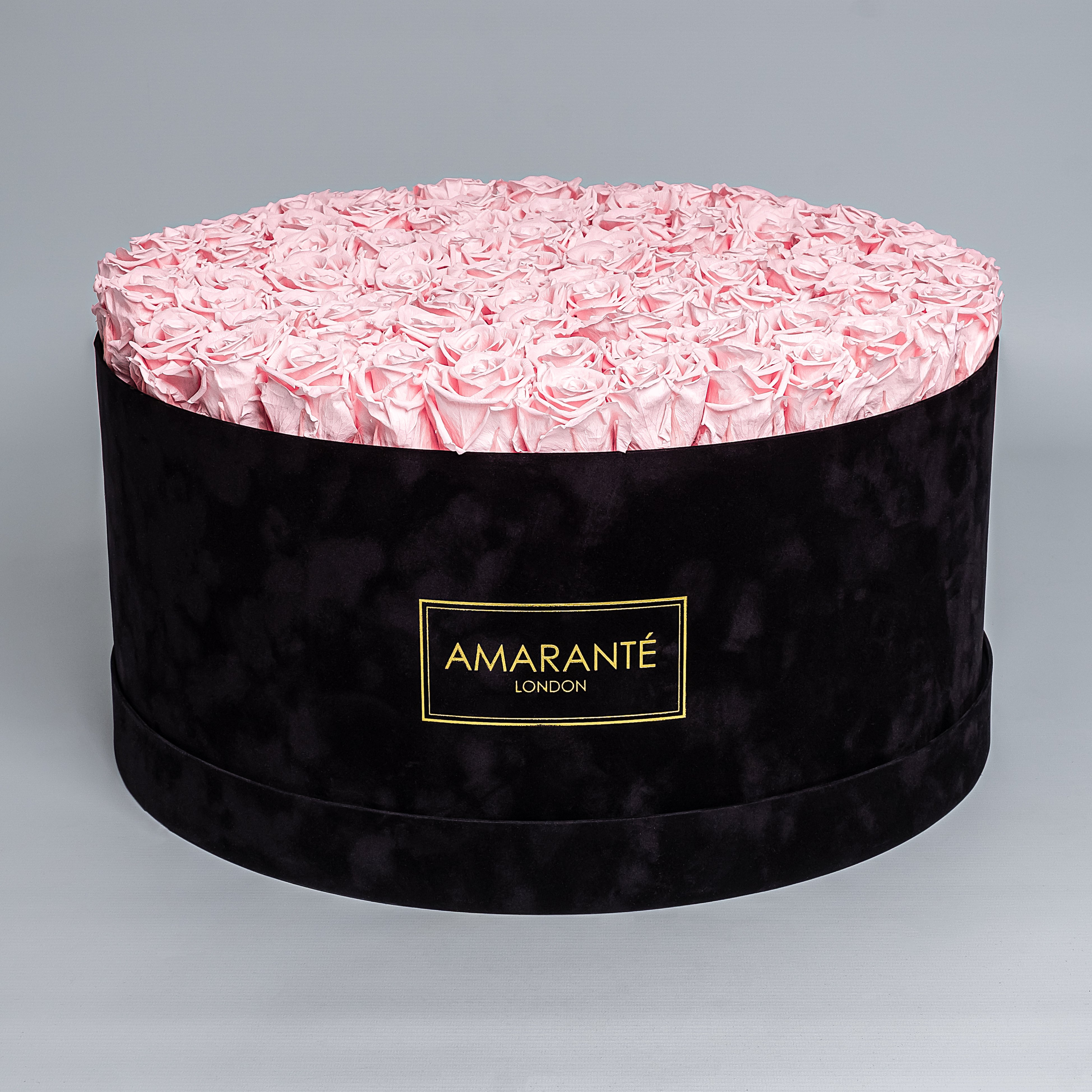 Luxurious black suede rose box filled with enchanting pink infinity roses showcasing refined style and grace. Ideal for family and friends that appreciate trendy and classy gifts on special occasions. Free UK Delivery.