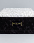 Super deluxe black square suede rose box, 20"x20", with 150 large white infinity roses.