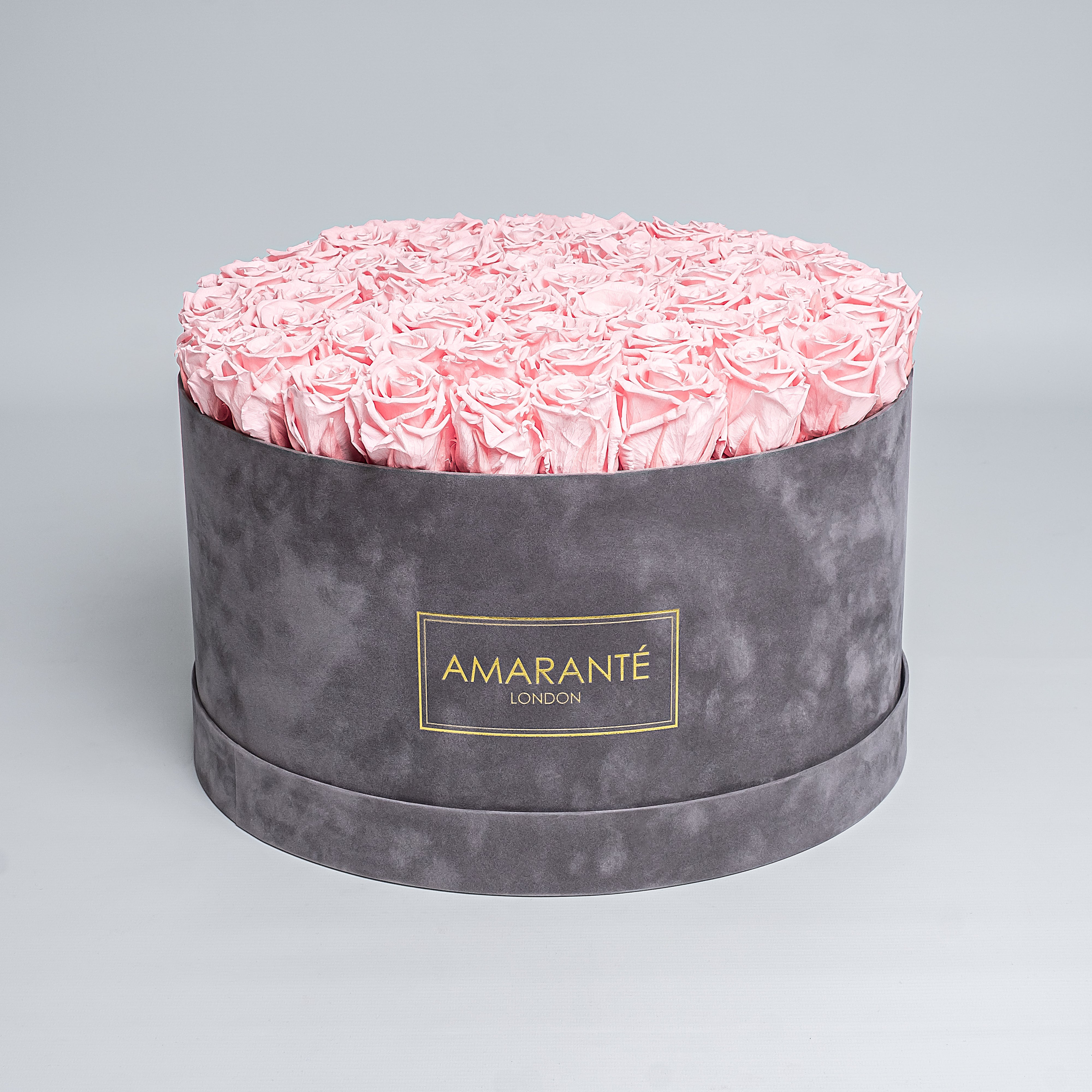 Exquisite delicate pink infinity roses in a sophisticated grey suede finish rose box. This chic, stylish gift idea, makes a thoughtful surprise for loved ones including mum, wife or a dear friend for any occasion, from Valentine&#39;s Day, to a Birthday or Anniversary or other important occasion. Free UK Delivery.