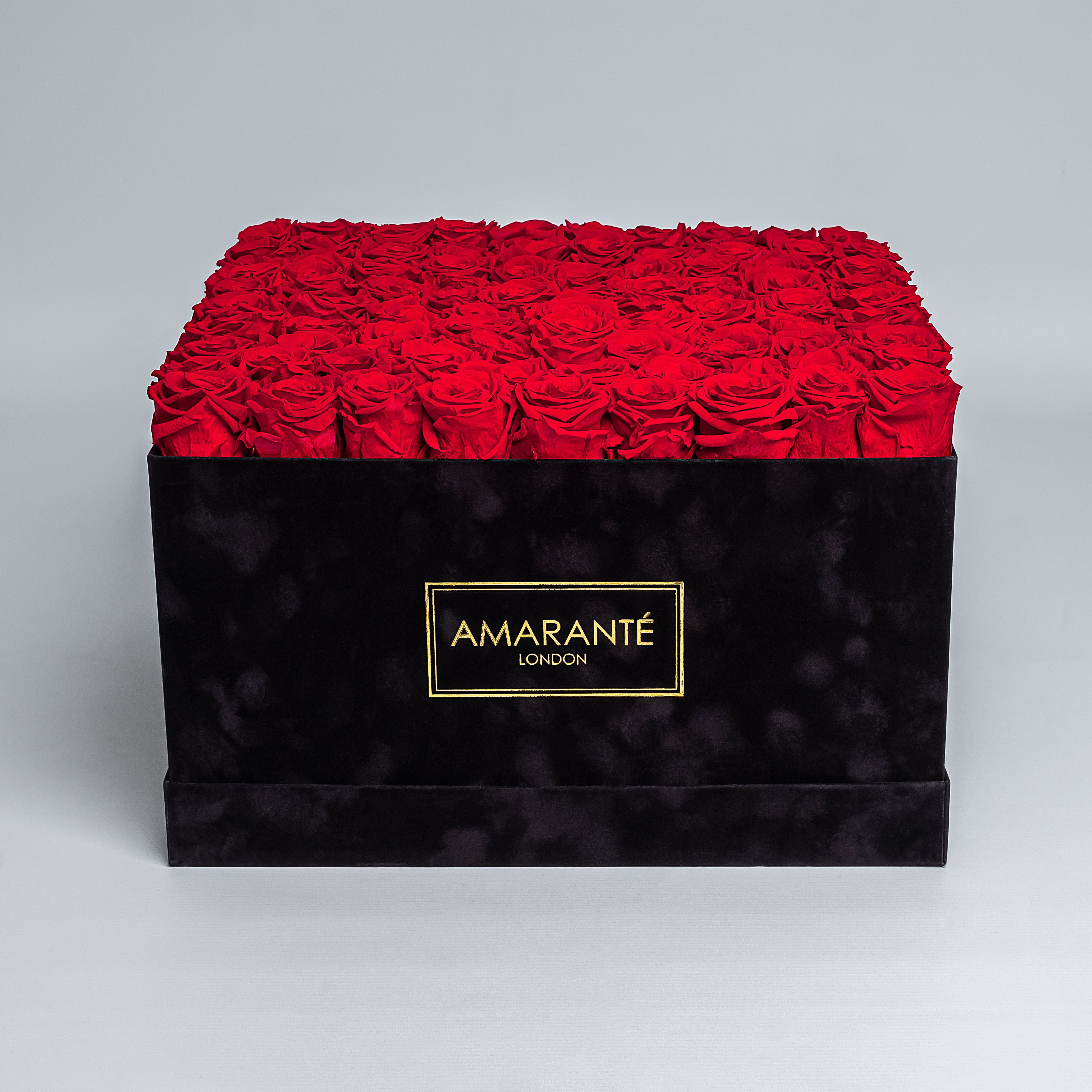 Luxurious black suede square hatbox with 100 large infinity roses, perfect for Valentine's Day, with free UK delivery. Each rose meticulously measures 2-3 inches, available in 14 colours