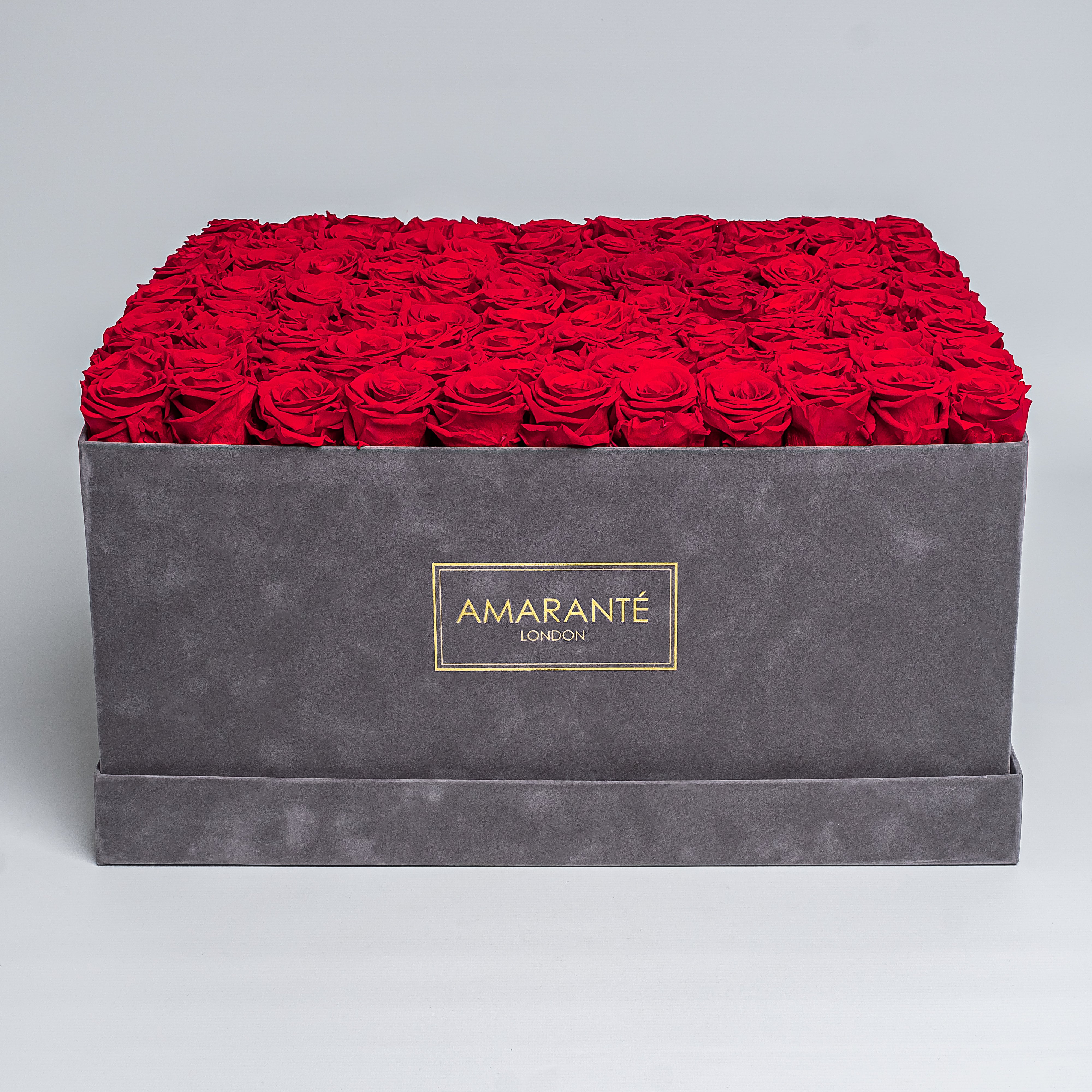 Exquisite grey suede square 20&quot;x20&quot; hatbox with 150 large red infinity roses, with the option to personalise your roses in other 14 delicate pastel shades, free UK delivery.