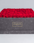 Exquisite grey suede square 20"x20" hatbox with 150 large red infinity roses, with the option to personalise your roses in other 14 delicate pastel shades, free UK delivery.