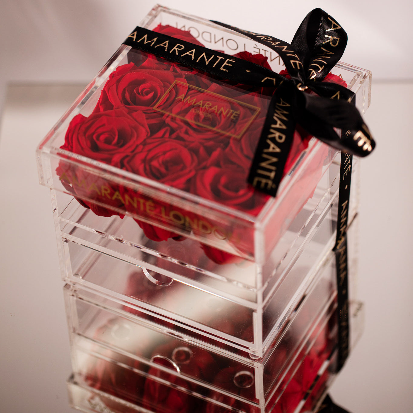 Nine stunning red Roses featured in a classic acrylic box 