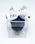 Royal Blue Infinity Rose in transparent acrylic box decorated with a white ribbon - a unique symbol of love and affection to celebrate Valentine's Day and other memorable romantic events with a touch of elegance and sophistication.