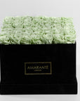 Refined taste of a timeless gift - 36 large mint green infinity roses in a stylish black suede rose box. Free UK Delivery.