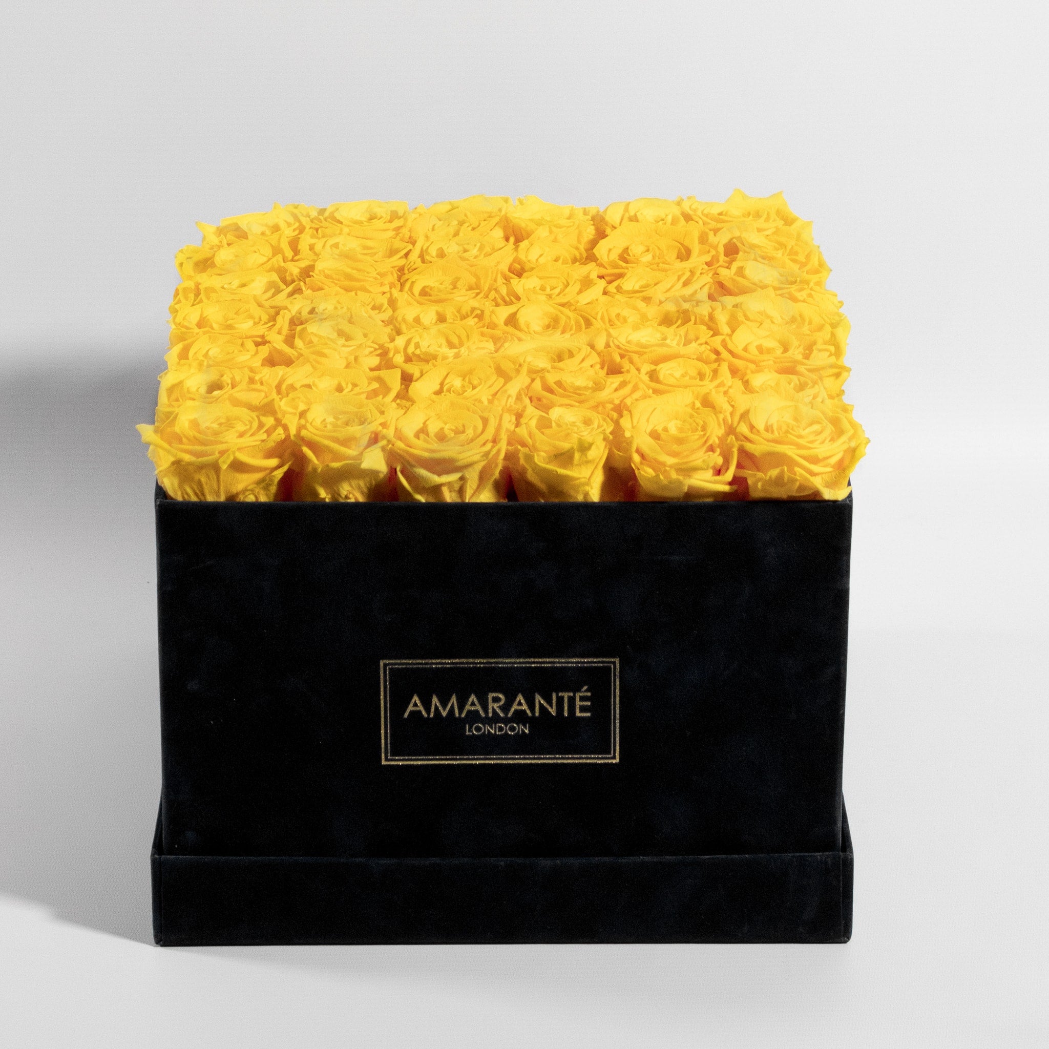 36 Mesmerising yellow forever roses neatly arranged in an elegant square suede rose box. Free UK Delivery.