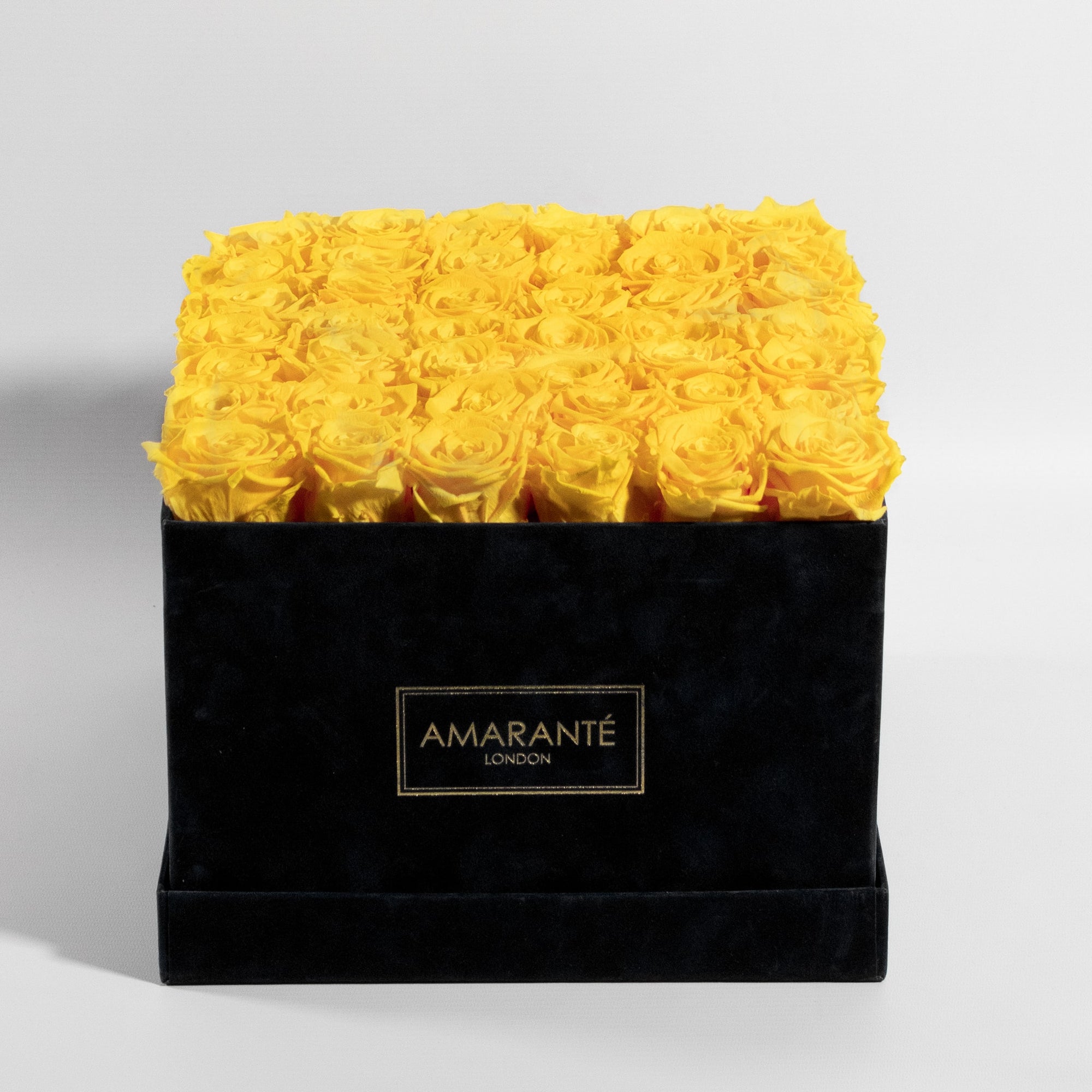 36 Mesmerising yellow forever roses neatly arranged in an elegant square suede rose box. Free UK Delivery.