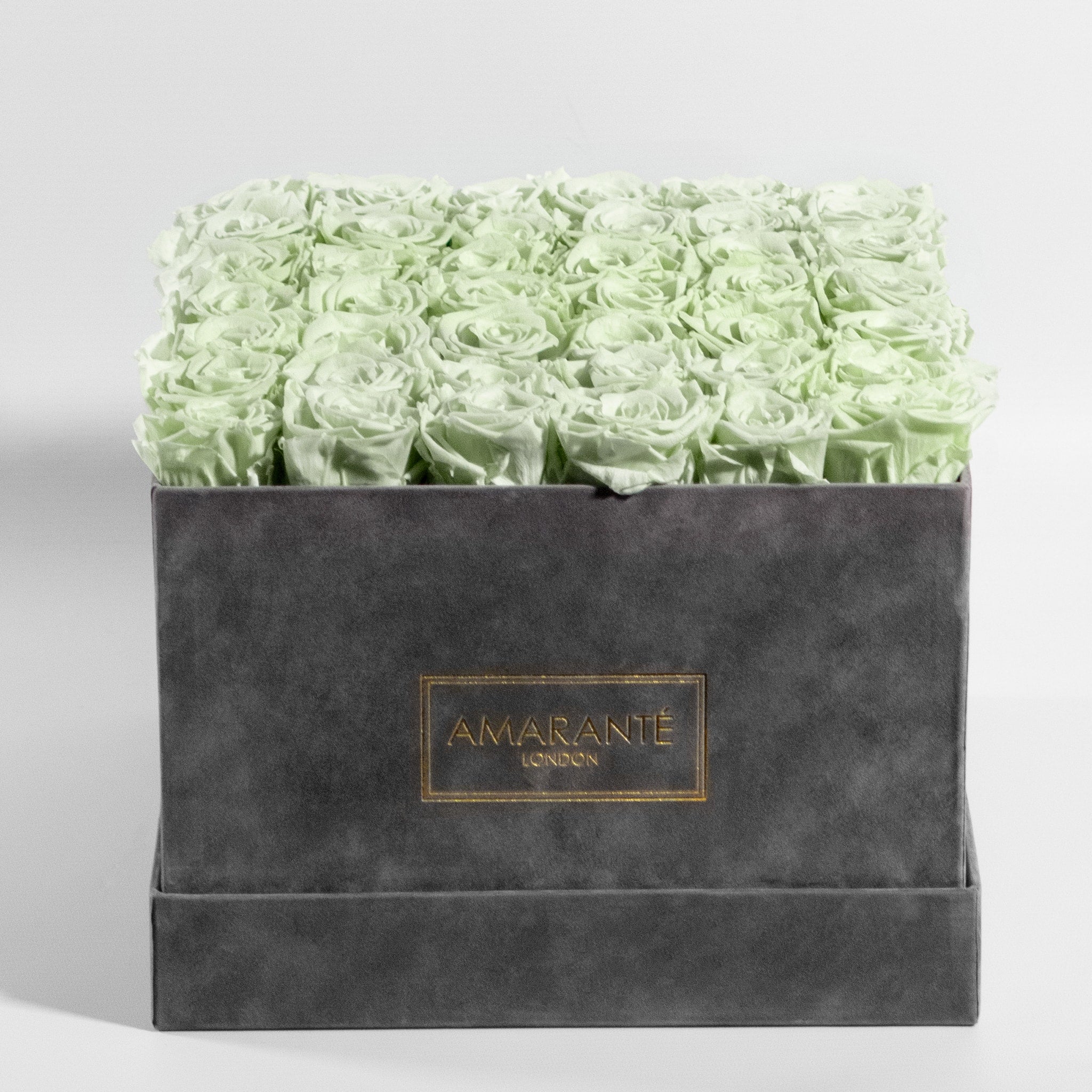 Captivating mint green Roses in a chic grey box