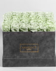 Captivating mint green Roses in a chic grey box