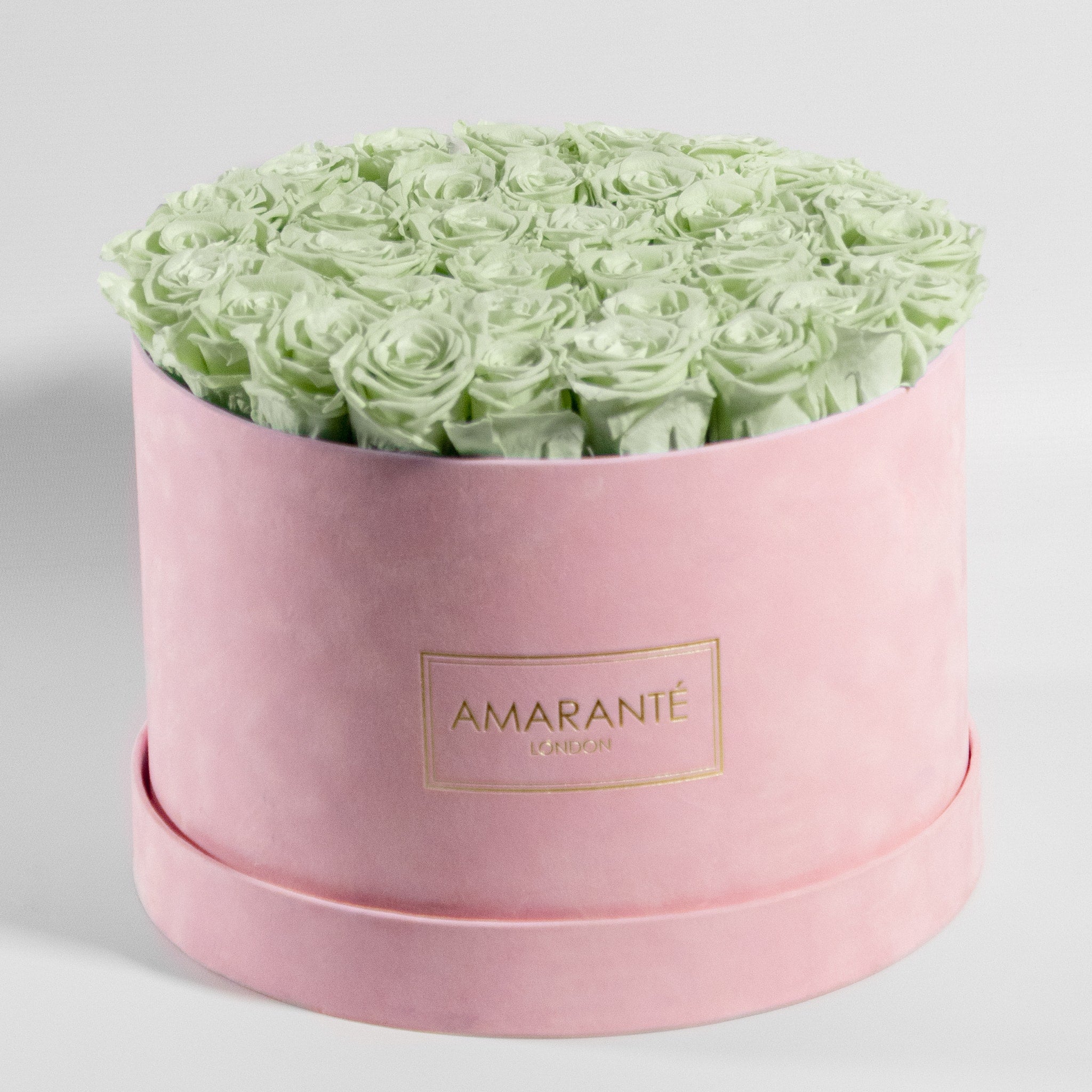 Revitalising mint green Roses, displayed in an idyllic pink box 