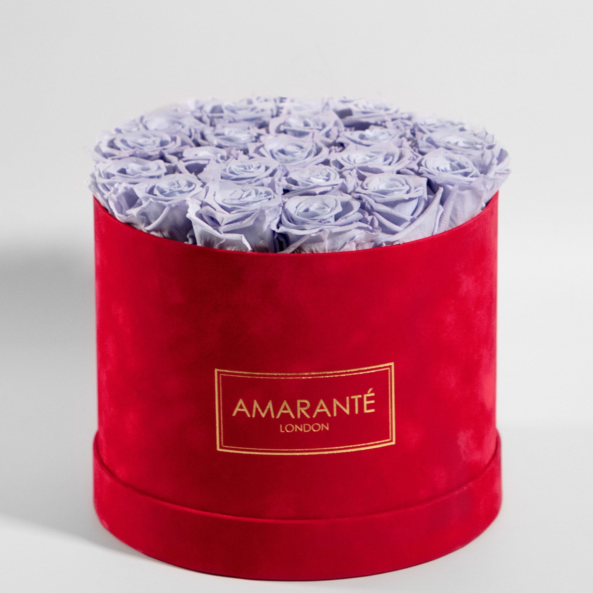 Fragrant lavender Roses imbedded in a magical red box