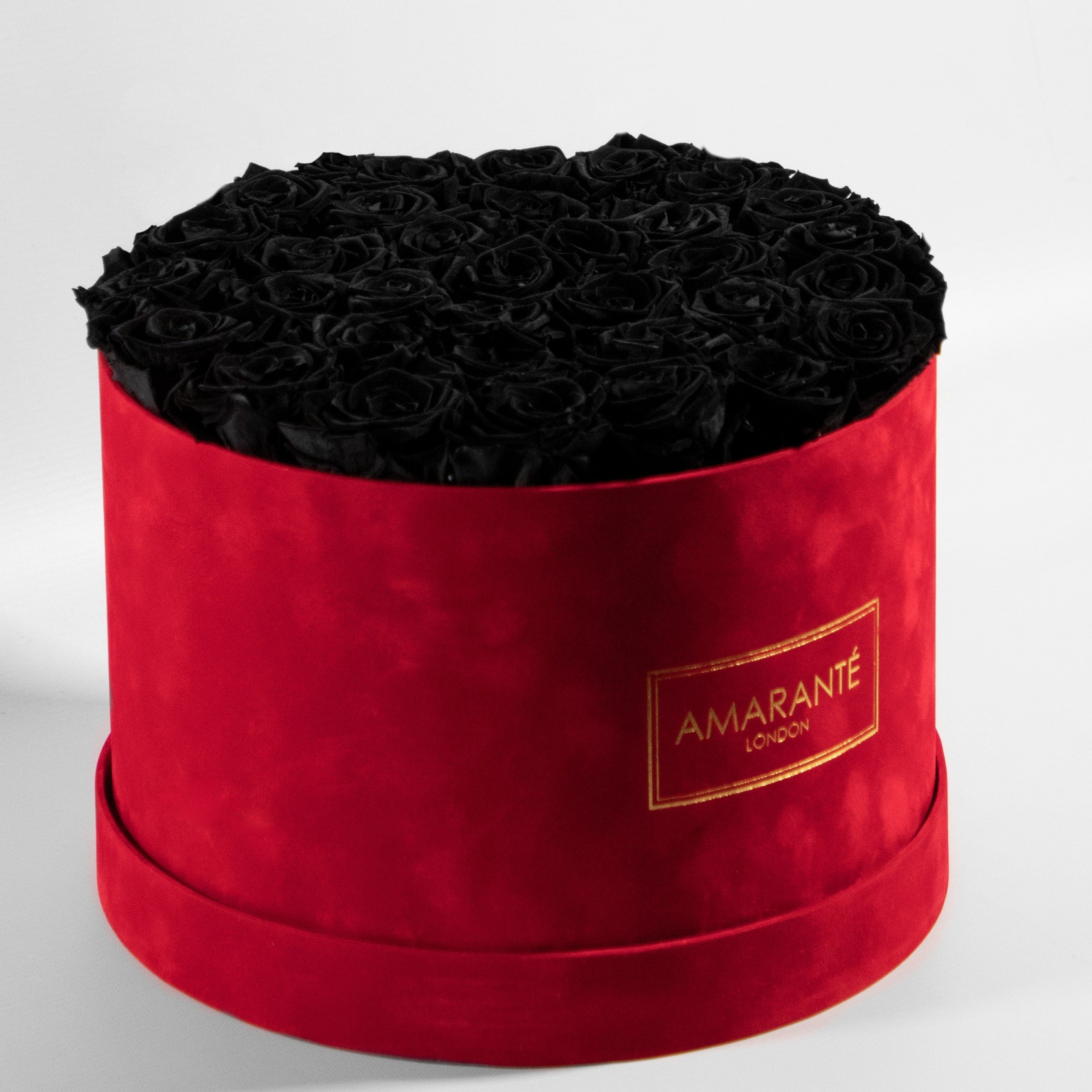 Majestic black Roes shown  in a striking red package connoting luxury and elegance. 