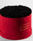 Majestic black Roes shown  in a striking red package connoting luxury and elegance. 