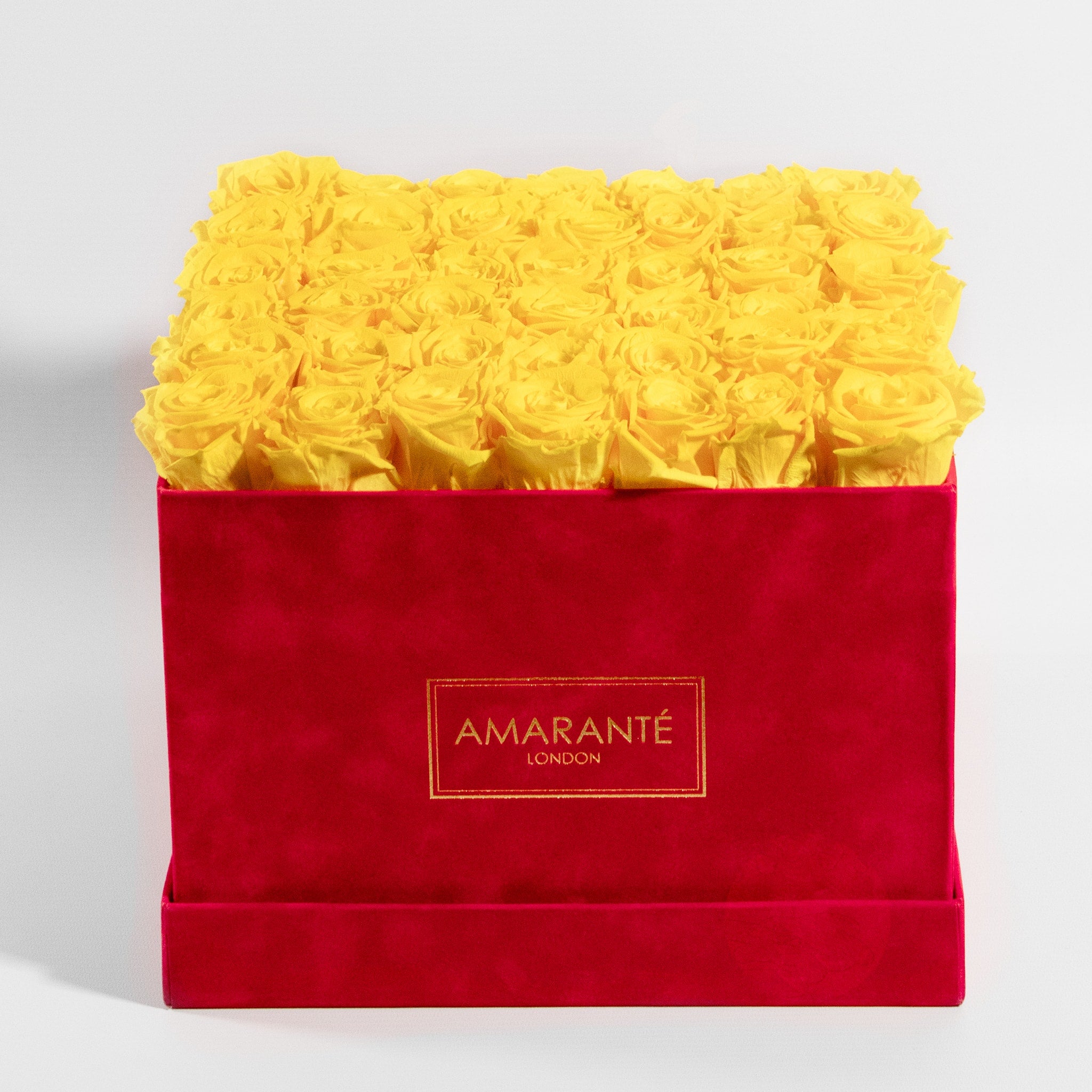 Delightful yellow roses exhibited in a magical red box 