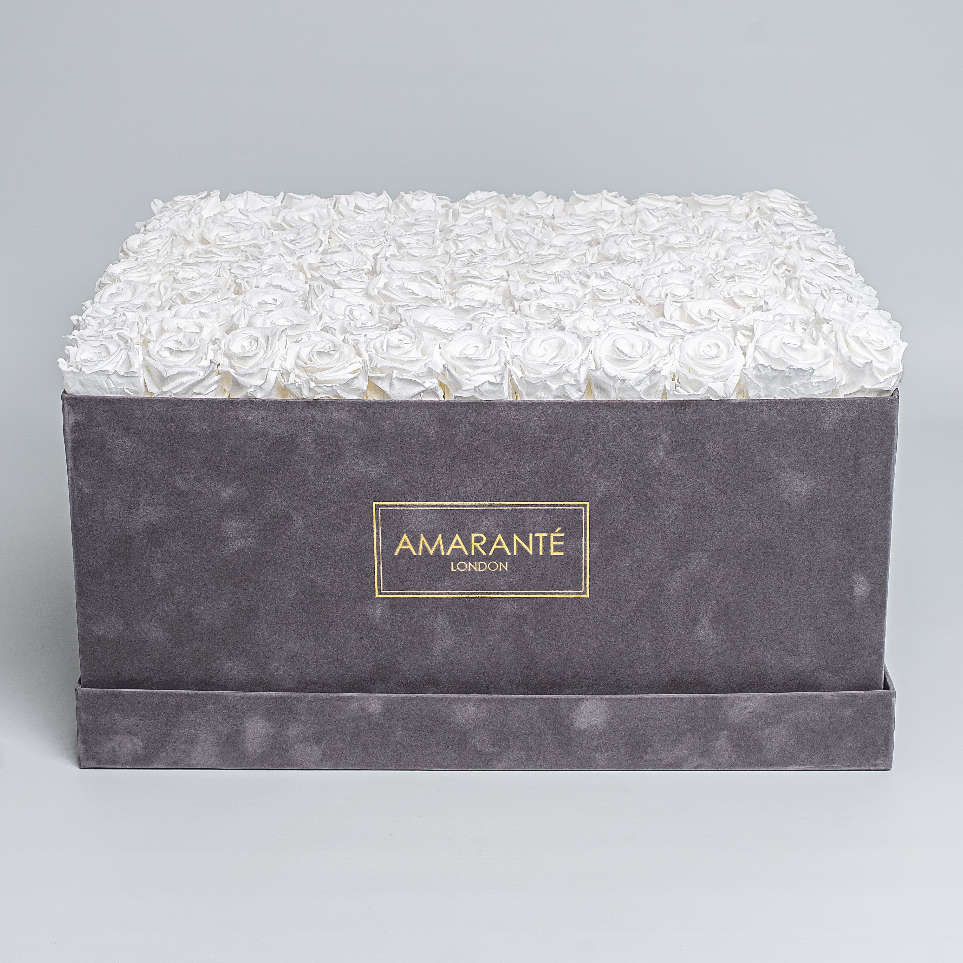 Super deluxe grey square suede rose box with 150 enchanting white infinity roses, a chic and timeless token of love - free UK delivery. Elegant rose box, 20&quot;x20&quot; size. Roses are also available on other 14 delicate pastel colours.