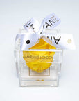 Captivating yellow single rose in an acrylic box with stylish ribbon for Valentine's Day and other romantic events in your life - Amaranté London.