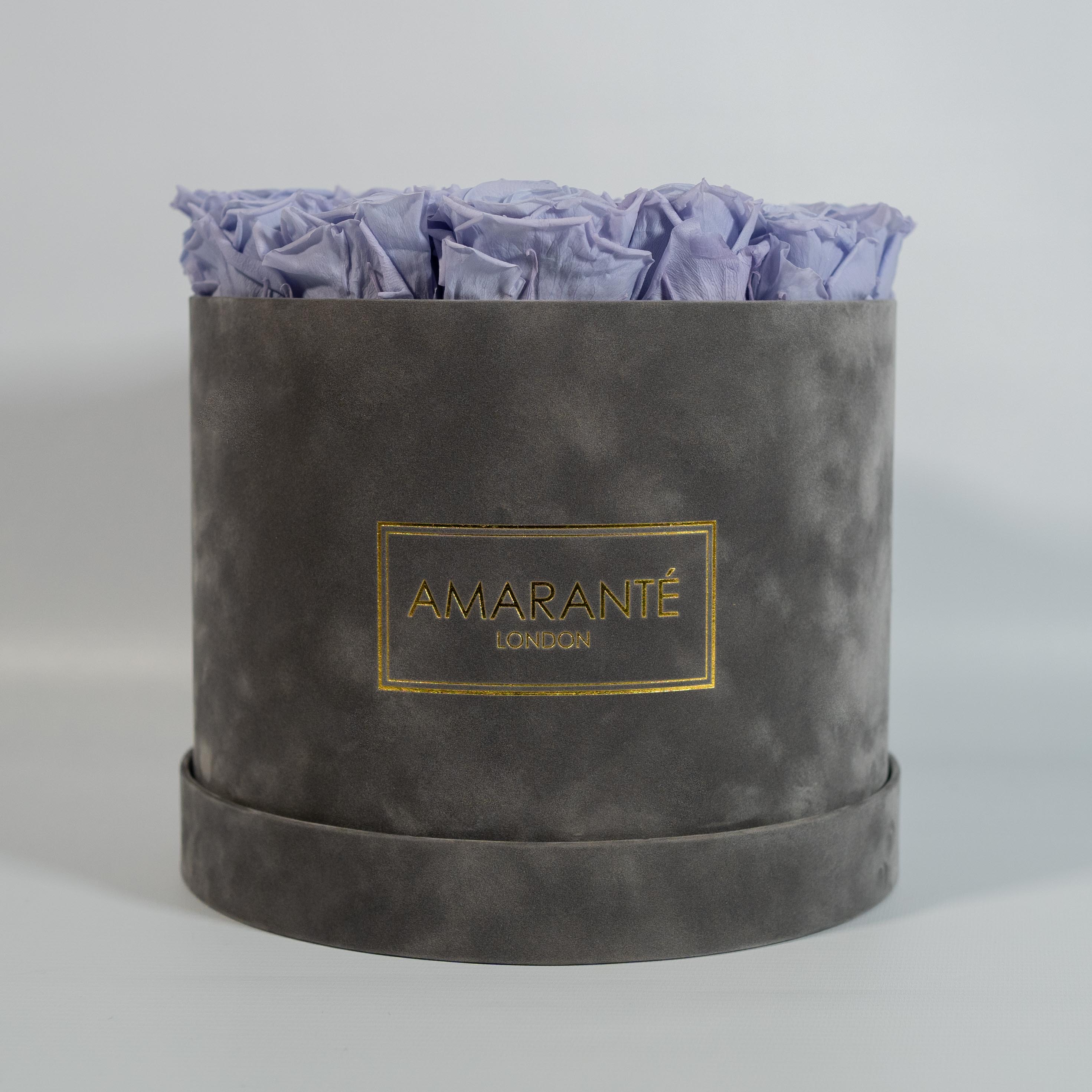 Fragrant lavender Roses encompassed in a modern grey box in round and large size 