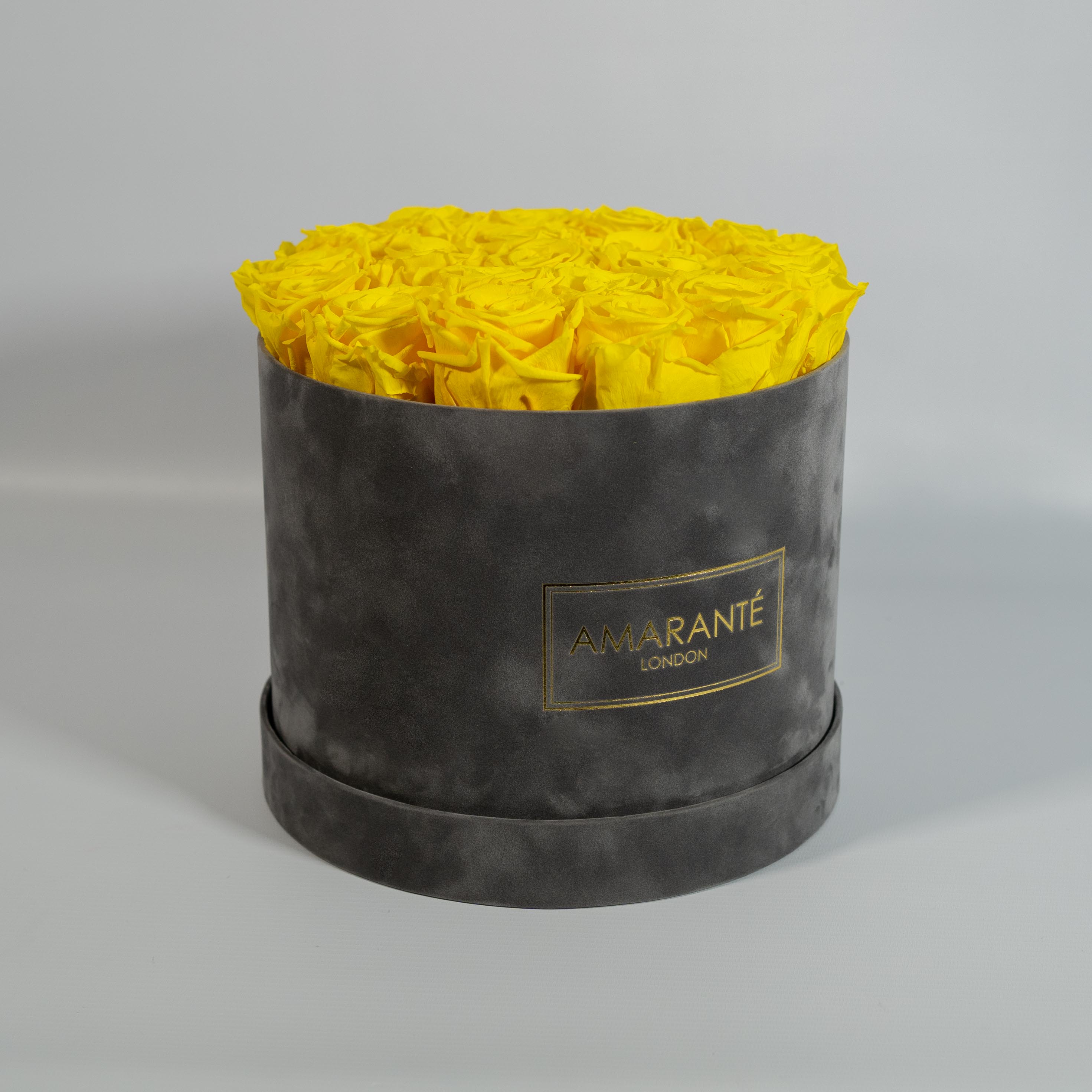 Aromatic yellow Roses featured in a creative grey large box