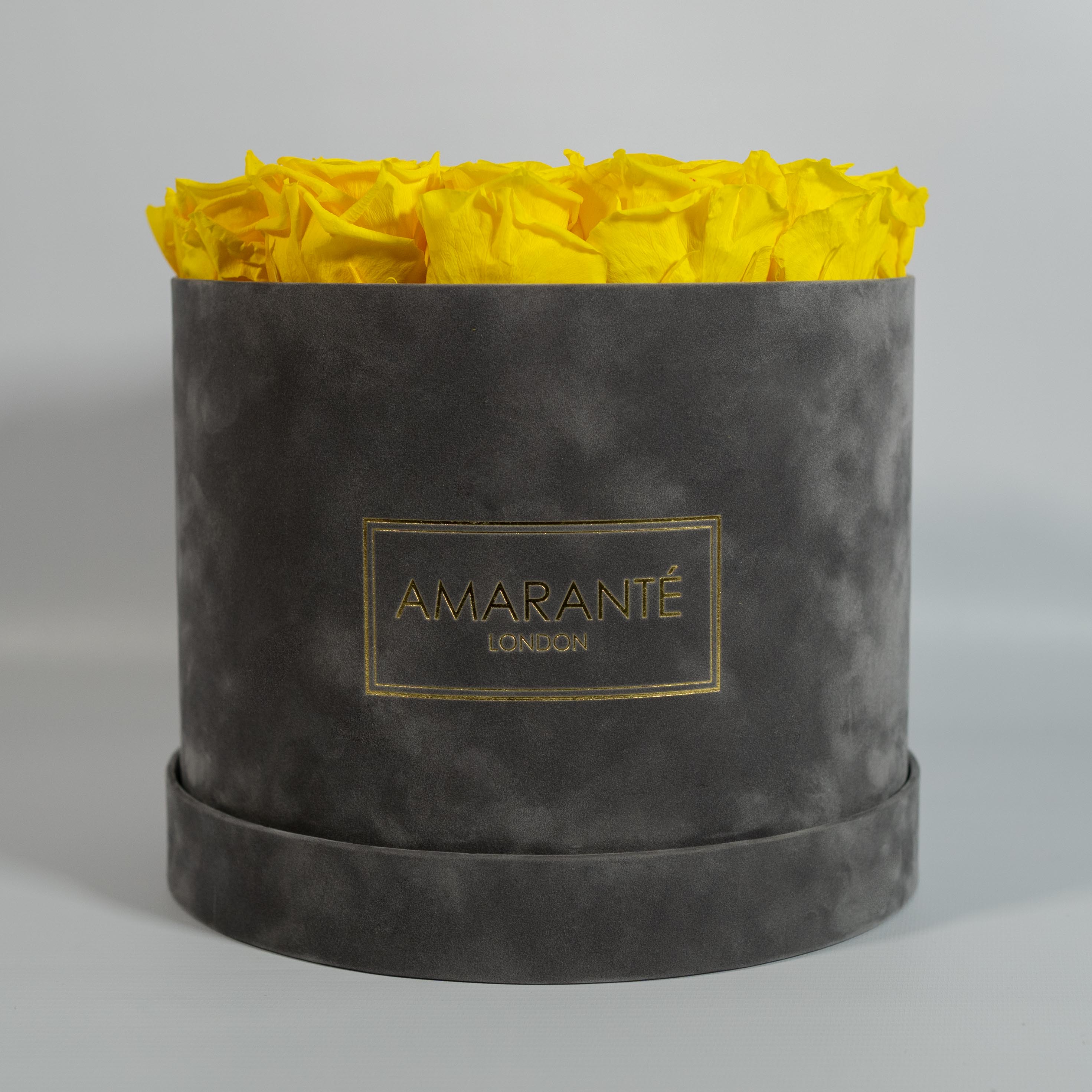 Warm yellow Roses presented in a modern grey large box 