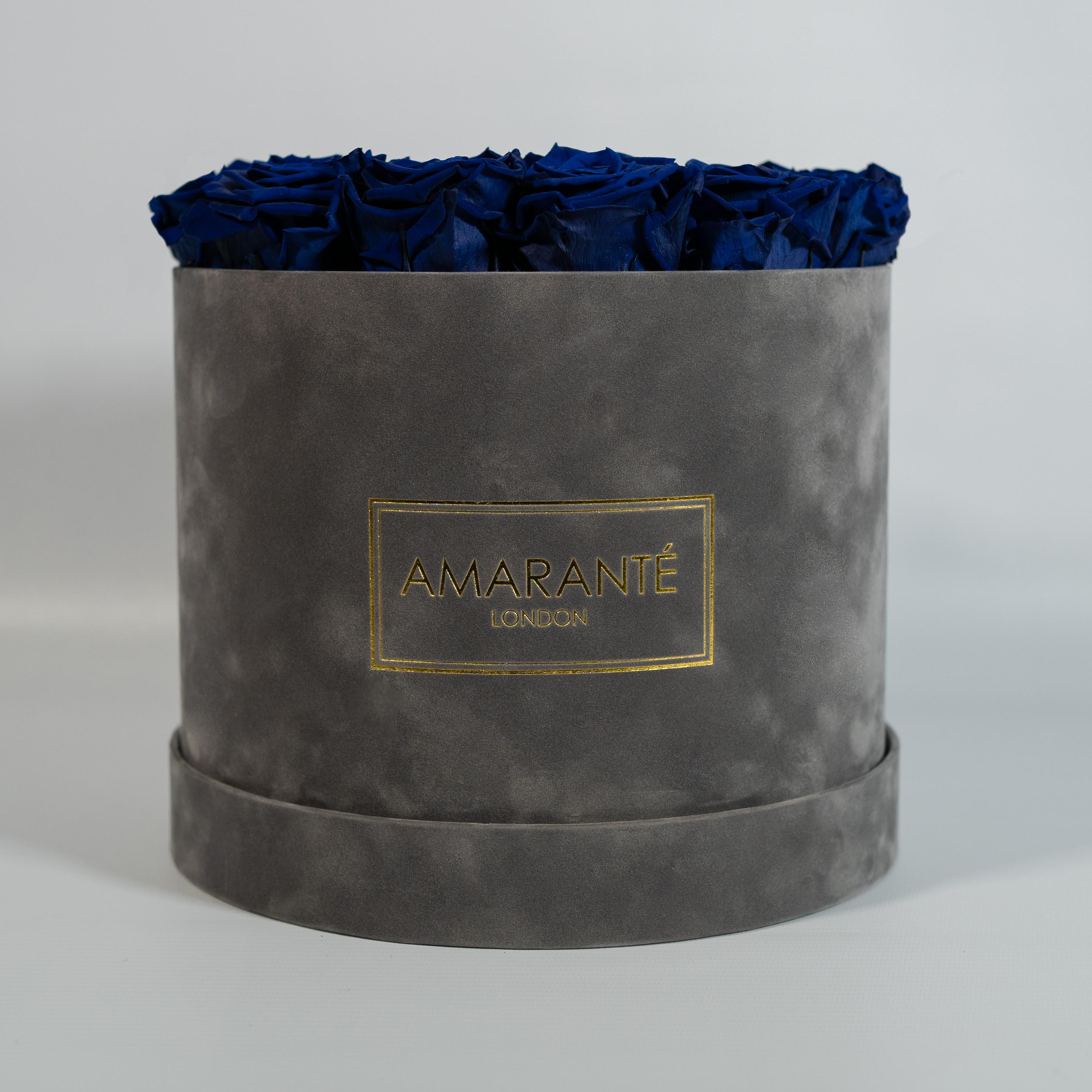 Aromatic royal blue roses presented in a modish grey box 