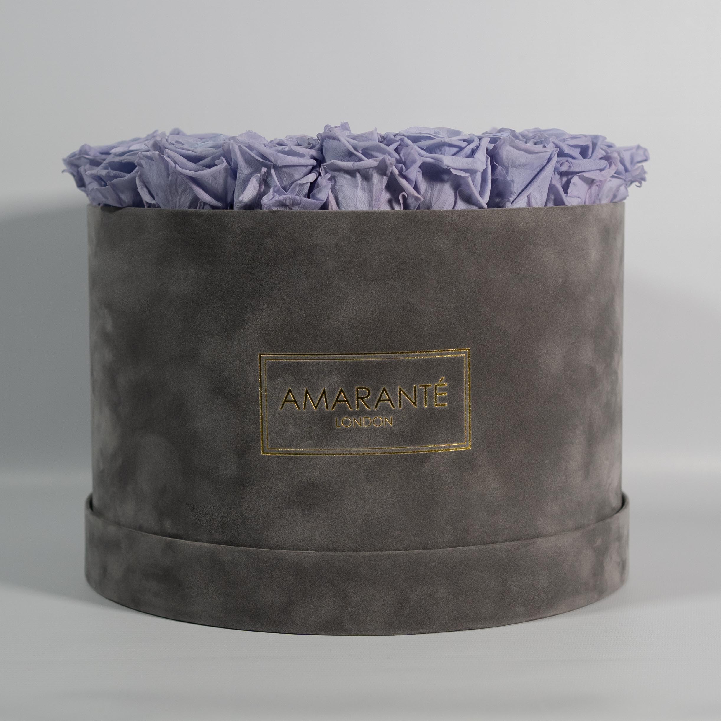 Spring-time inspired Lavender Roses imbedded in a stunning grey package. 