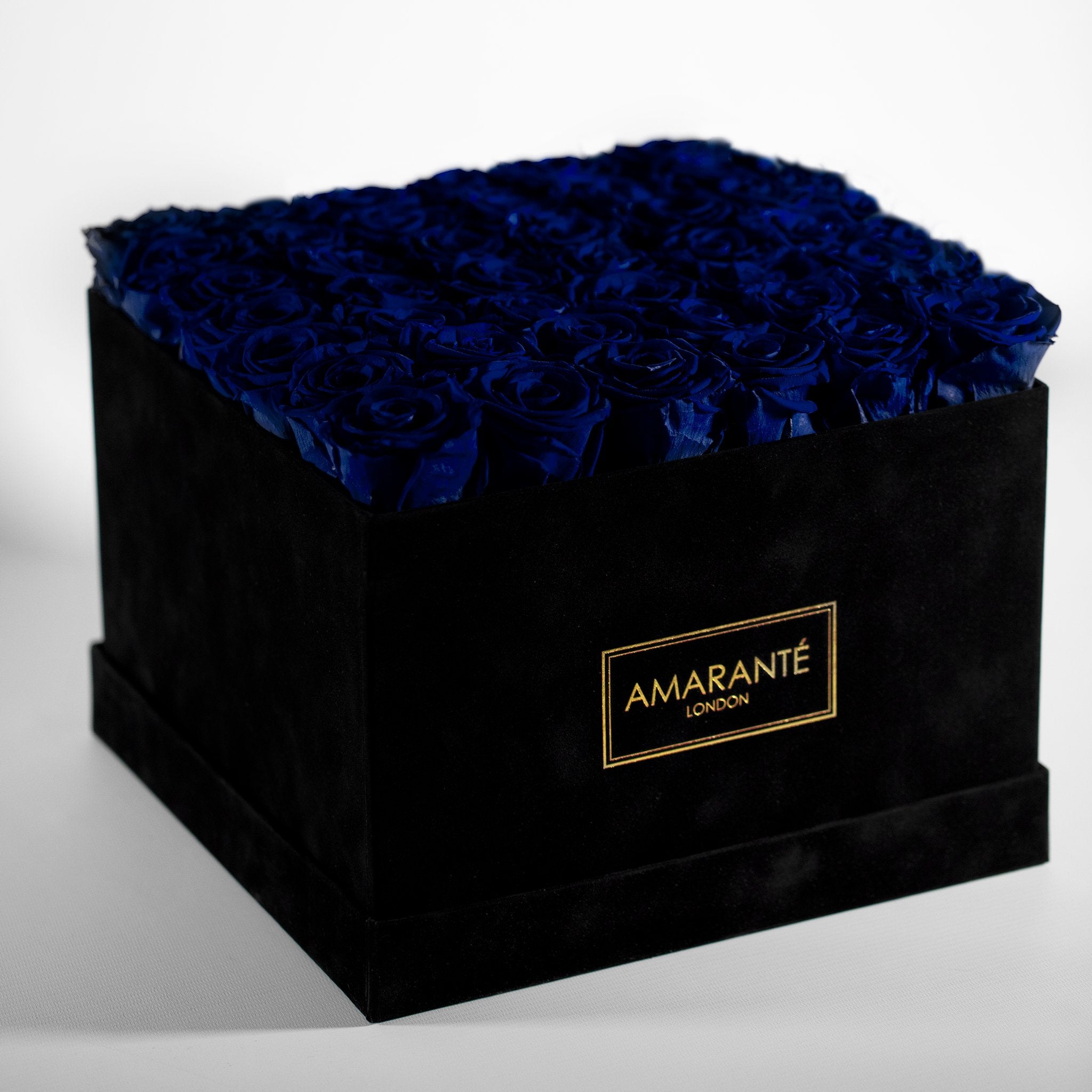 Classy extra-large rose box carrying radiant large royal blue infinity roses. Free UK Delivery.