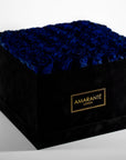 Luxurious Royal blue Roses displayed in a classy black box. 