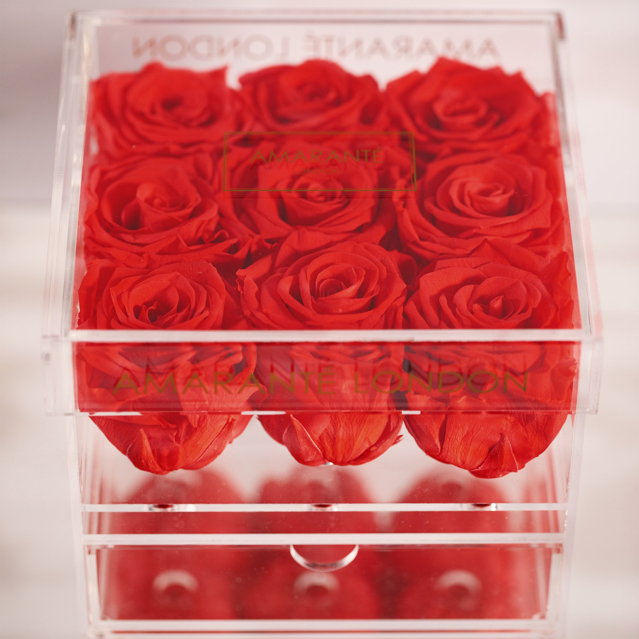 Expressive hot pink Roses encompassed in gorgeous acrylic box 