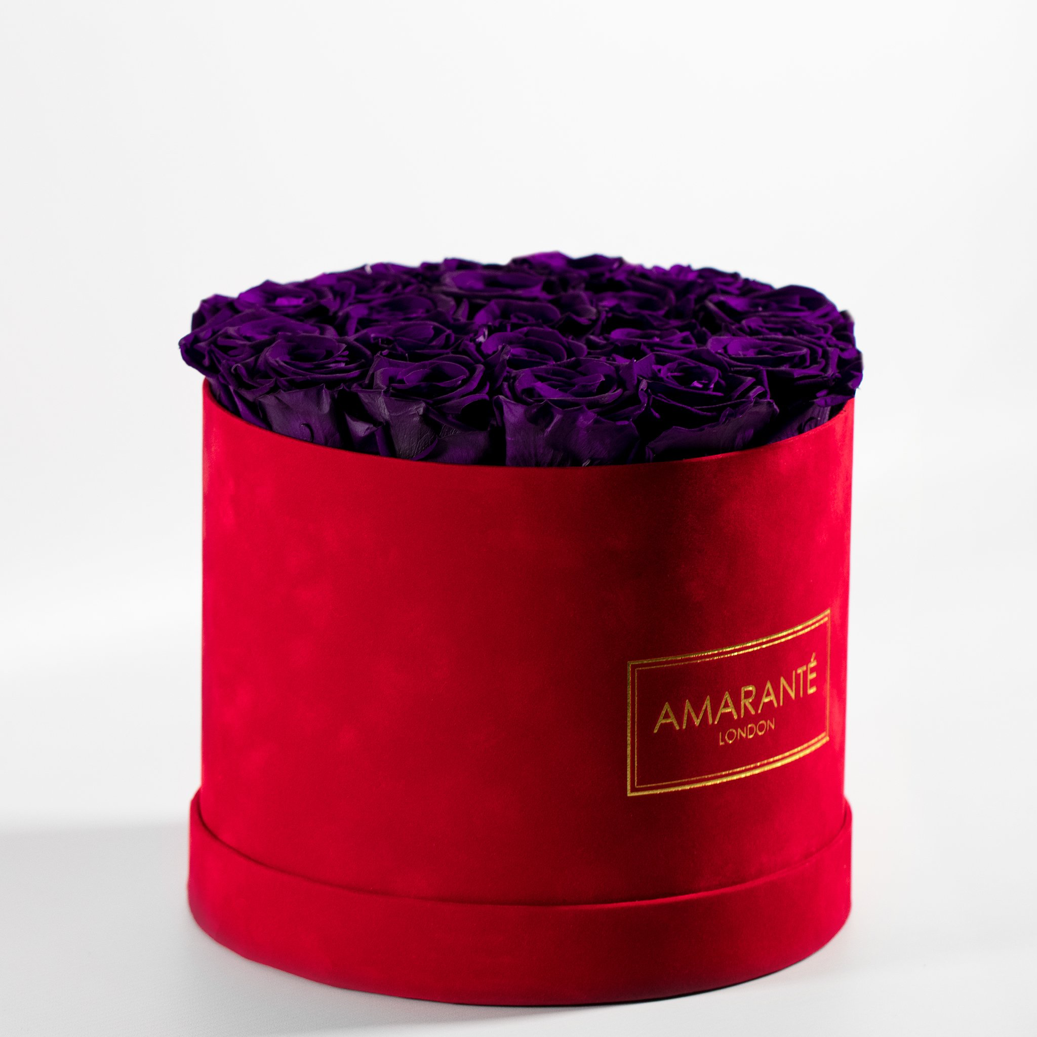 Enchanting dark purple Roses encompassed in a delicate red box 