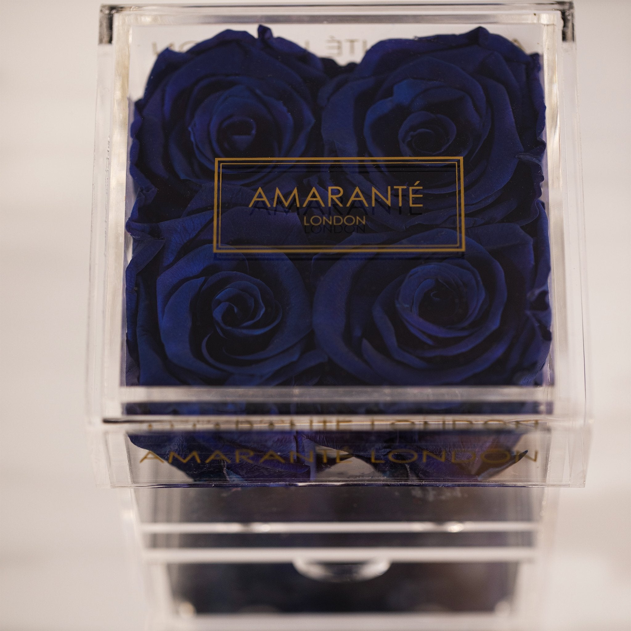 Luxurious royal blue roses encompassed in a stylish box 