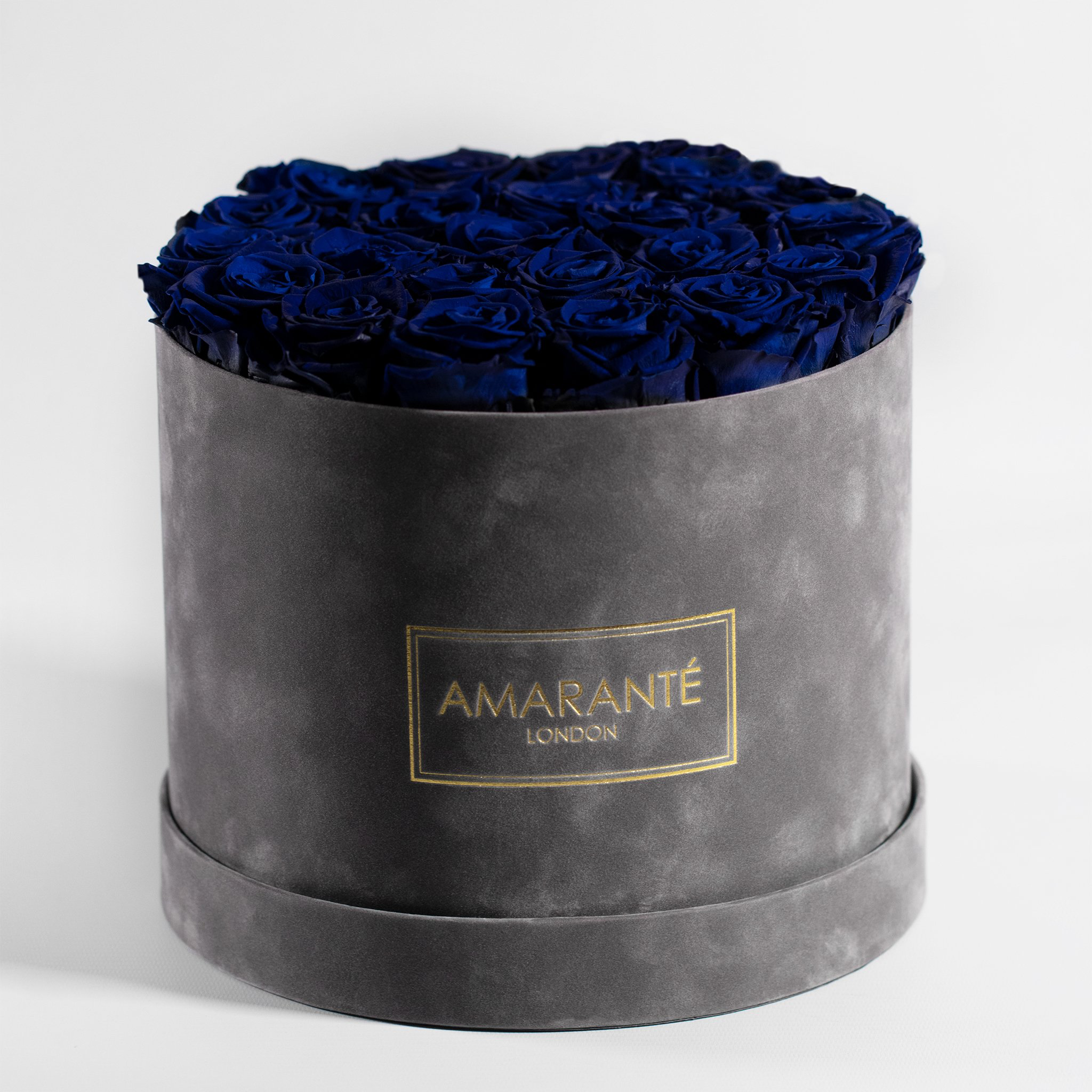 Dreamy royal blue Roses accessible in a large round grey box 